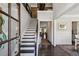 Inviting foyer with hardwood floors, staircase, and views into the living room at 187 Still Pine Bnd, Smyrna, GA 30082