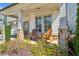 Charming front porch featuring wooden chairs and stone columns at 187 Still Pine Bnd, Smyrna, GA 30082