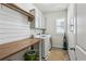 Well-organized laundry room with modern washer and dryer and folding table at 187 Still Pine Bnd, Smyrna, GA 30082