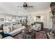 Cozy living room featuring an open floor plan, stylish furniture, and modern recessed lighting at 187 Still Pine Bnd, Smyrna, GA 30082
