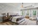 Serene main bedroom with tray ceilings, floral wallpaper, and an abundance of natural light at 187 Still Pine Bnd, Smyrna, GA 30082