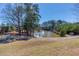 Beautiful pond with a fountain surrounded by lush trees and walking trails for a serene community setting at 187 Still Pine Bnd, Smyrna, GA 30082