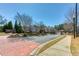 Street view of a well-maintained community with manicured lawns, sidewalks and decorative street lamps at 187 Still Pine Bnd, Smyrna, GA 30082