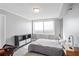 Minimalist bedroom featuring a large window and neutral decor at 2479 Peachtree Ne Rd # 1606, Atlanta, GA 30305