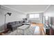 Modern gray living room featuring a hardwood floor and a city view window at 2479 Peachtree Ne Rd # 1606, Atlanta, GA 30305