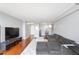Open-concept living room featuring hardwood floors, gray walls, and modern furniture at 2479 Peachtree Ne Rd # 1606, Atlanta, GA 30305