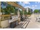 Outdoor grilling area with gas grills, countertop space, and table and chairs at 2479 Peachtree Ne Rd # 1606, Atlanta, GA 30305