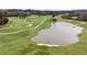 Picturesque aerial view of golf course with pond and lush greenery at 50 Biscayne Nw Dr # 6111, Atlanta, GA 30309