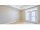 Cozy bedroom featuring soft carpet and access to balcony with french doors at 50 Biscayne Nw Dr # 6111, Atlanta, GA 30309
