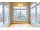 Sunlit dining area with hardwood floors, large windows offering city views at 50 Biscayne Nw Dr # 6111, Atlanta, GA 30309
