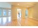 Bright living room with hardwood floors, natural light, and view of the stainless steel appliances at 50 Biscayne Nw Dr # 6111, Atlanta, GA 30309