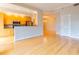 Combined living and kitchen space with open layout, stainless steel appliances, and wood floors at 50 Biscayne Nw Dr # 6111, Atlanta, GA 30309