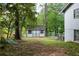 Cozy backyard with a small shed in a wooded area at 5384 Blackhawk Dr, Acworth, GA 30102
