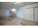 Unfinished basement area with concrete floor and stairs to the upper level at 5384 Blackhawk Dr, Acworth, GA 30102