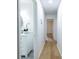 Hallway with a view of the bathroom featuring modern cabinets and marble countertops at 5384 Blackhawk Dr, Acworth, GA 30102