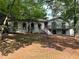 Charming white brick home featuring a spacious front yard and a deck perfect for outdoor relaxation at 5384 Blackhawk Dr, Acworth, GA 30102