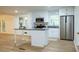 Well-lit kitchen featuring white cabinets, stainless steel appliances, and an island with granite countertop at 5384 Blackhawk Dr, Acworth, GA 30102