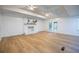 Bright living room featuring wood floors, brick fireplace and double doors leading outside at 5384 Blackhawk Dr, Acworth, GA 30102