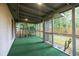 Cozy screened-in porch overlooking the backyard with a newly installed wooden privacy fence at 5384 Blackhawk Dr, Acworth, GA 30102