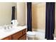 Bathroom with a single sink vanity, a bathtub and shower combo with blue curtain at 2130 Monhegan Se Way # 11, Smyrna, GA 30080