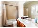Bathroom featuring a shower and tub combo with a tiled wall, and single sink vanity at 2130 Monhegan Se Way # 11, Smyrna, GA 30080