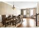 Dining room with wood floor, seating for six, and view into formal living area at 2130 Monhegan Se Way # 11, Smyrna, GA 30080