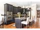 Modern kitchen with black cabinets, granite countertops, and stainless steel appliances, perfect for cooking at 2130 Monhegan Se Way # 11, Smyrna, GA 30080