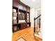 Mudroom or entryway with dark wood cabinets and hardwood floors near the staircase at 2130 Monhegan Se Way # 11, Smyrna, GA 30080
