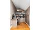 Small home office with desk, custom wood storage, and hardwood floors at 2130 Monhegan Se Way # 11, Smyrna, GA 30080