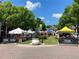 Lively street market with vendor tents and community members enjoying local goods and treats at 2130 Monhegan Se Way # 11, Smyrna, GA 30080
