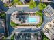Aerial view of a well-maintained community pool with lounge chairs and manicured landscaping at 2130 Monhegan Se Way # 11, Smyrna, GA 30080
