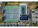 Aerial view showcases community pool, tennis courts, clubhouse and parking area at 2382 Gallard St, Lawrenceville, GA 30043