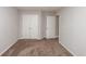 Bedroom with neutral paint, plush carpet, standard closet and hallway and en suite access at 2382 Gallard St, Lawrenceville, GA 30043