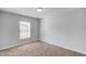 Bedroom featuring neutral carpet and walls, with a window at 2382 Gallard St, Lawrenceville, GA 30043