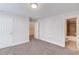 Spacious bedroom with neutral walls and carpet, doors to closet and bathroom at 2382 Gallard St, Lawrenceville, GA 30043