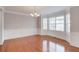 Dining area featuring hardwood floors, wainscoting detail, and ample natural light at 2382 Gallard St, Lawrenceville, GA 30043