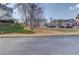 Exterior view of townhomes with lawns, trees and parking visible from the street at 2382 Gallard St, Lawrenceville, GA 30043