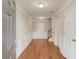 Entrance foyer featuring hardwood flooring, white trim, and multiple entrances at 2382 Gallard St, Lawrenceville, GA 30043