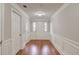 Inviting foyer with hardwood floors, white molding, and natural light from the front door at 2382 Gallard St, Lawrenceville, GA 30043