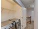 Convenient laundry area on the upper level with modern machines and hallway access at 2382 Gallard St, Lawrenceville, GA 30043