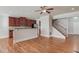 Open-concept living space with hardwood floors, neutral walls, and a staircase with iron railing at 2382 Gallard St, Lawrenceville, GA 30043