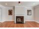 Spacious living room featuring a fireplace, hardwood floors and classic wall decor at 2382 Gallard St, Lawrenceville, GA 30043
