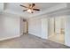 Spacious main bedroom features a ceiling fan, tray ceiling, and ensuite bathroom access at 2382 Gallard St, Lawrenceville, GA 30043