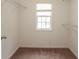 Walk-in closet featuring a window, carpet, and wire shelving at 2382 Gallard St, Lawrenceville, GA 30043
