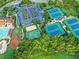 An aerial view showcases the community amenities, including tennis courts, a playground, and a parking lot at 3006 Cambridge Hill Dr, Dacula, GA 30019