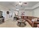 Open-concept basement featuring a sectional sofa and view of the staircase at 3006 Cambridge Hill Dr, Dacula, GA 30019