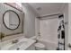 Bathroom with a tub/shower combo, single vanity, and decorative mirror at 3006 Cambridge Hill Dr, Dacula, GA 30019