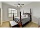 Comfortable bedroom featuring a stately four-poster bed, soft lighting, and a serene atmosphere at 3006 Cambridge Hill Dr, Dacula, GA 30019