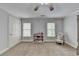 Spacious bedroom with neutral carpet, ample natural light from two windows, and room for personalization at 3006 Cambridge Hill Dr, Dacula, GA 30019