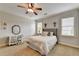 Cozy bedroom featuring neutral colors, a desk, and plenty of natural light at 3006 Cambridge Hill Dr, Dacula, GA 30019